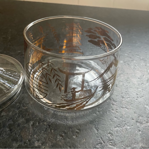 Round clear glass trinket jar with a lid, adorned with gold Asian symbols - Picture 2 of 9
